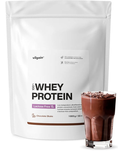 Lactose-Free Whey Protein 1000 g chocolate shake in a glass next to the protein powder bag.